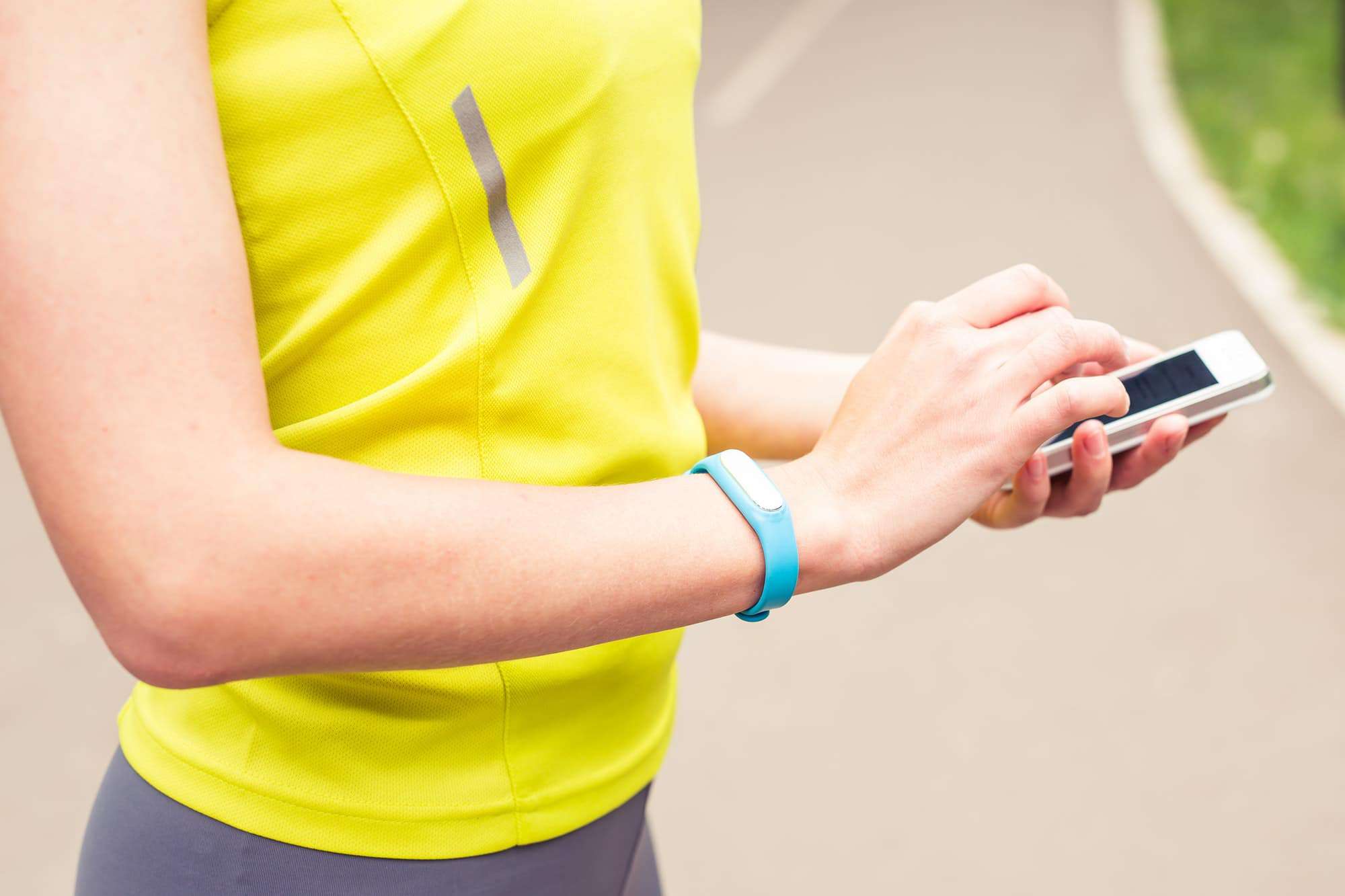 Hand wearing a fitness tracking armband