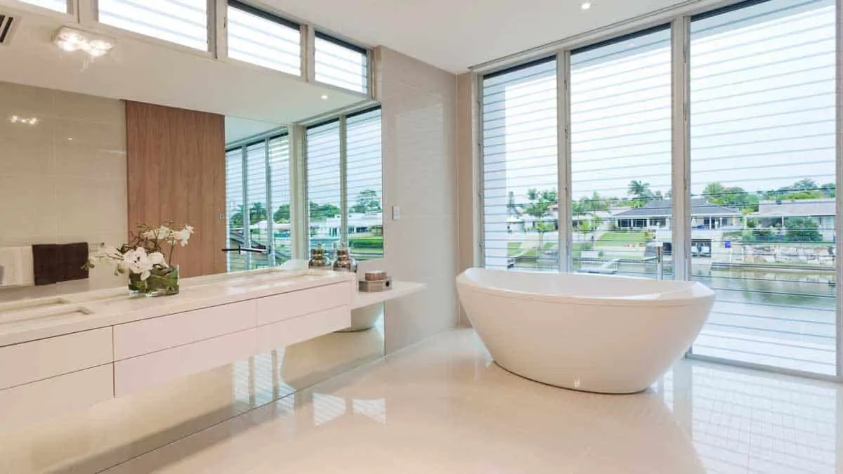 luxury bathroom with large window treatments